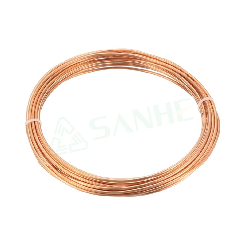 Close-up of a copper capillary tube coil used in HVAC systems for precise refrigerant flow control.